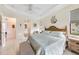 The spacious primary bedroom boasts great natural light, neutral decor and tiled floors at 9548 Applin Cir, Port Charlotte, FL 33981