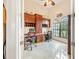 Home office features built-in cabinetry, a large window, and tiled floors at 9548 Applin Cir, Port Charlotte, FL 33981