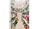 Well-stocked pantry with multiple shelves, providing ample storage for groceries and kitchen essentials for organization at 9548 Applin Cir, Port Charlotte, FL 33981