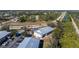 Aerial view of a building, parking lot, and surrounding area at 9900 Fiddlers Green Cir # 137, Rotonda West, FL 33947