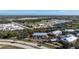 Aerial view of a building, parking lot, and surrounding area at 9900 Fiddlers Green Cir # 137, Rotonda West, FL 33947