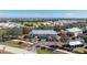 Aerial view of a building, parking lot, and surrounding area at 9900 Fiddlers Green Cir # 137, Rotonda West, FL 33947