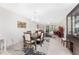 Elegant dining room with dark wood table and chairs at 9900 Fiddlers Green Cir # 137, Rotonda West, FL 33947