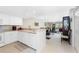 Bright white kitchen features ample cabinetry and modern appliances at 9900 Fiddlers Green Cir # 137, Rotonda West, FL 33947