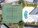Aerial view of community pool and tennis courts at 9900 Fiddlers Green Cir # 137, Rotonda West, FL 33947