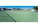 Well-maintained tennis court in a sunny community setting at 9900 Fiddlers Green Cir # 137, Rotonda West, FL 33947