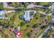 Aerial view of property showing house, pool, and surrounding landscape at 1080 Bayshore Dr, Englewood, FL 34223