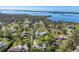 Aerial view of waterfront homes and lush landscape at 1080 Bayshore Dr, Englewood, FL 34223