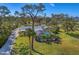 Aerial view of home, showcasing the pool and large lot at 1080 Bayshore Dr, Englewood, FL 34223