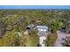 Aerial view of property highlighting the house, garage, and RV shelter at 1080 Bayshore Dr, Englewood, FL 34223