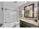 Modern bathroom with white subway tiles and granite countertop at 1080 Bayshore Dr, Englewood, FL 34223