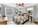 Charming bedroom with a wooden bed frame and window coverings at 1080 Bayshore Dr, Englewood, FL 34223