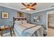 Serene bedroom with a ceiling fan and mirrored closet doors at 1080 Bayshore Dr, Englewood, FL 34223