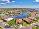 Aerial photo highlighting the property's desirable location with lake views, ideal for homebuyers at 13347 Golf Pointe Dr, Port Charlotte, FL 33953