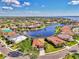 Breathtaking aerial view showcasing the home's location with serene lake and water views at 13347 Golf Pointe Dr, Port Charlotte, FL 33953