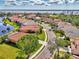 High-angle aerial view displaying the home's setting within a lush, waterfront community at 13347 Golf Pointe Dr, Port Charlotte, FL 33953