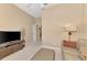 Bright living room featuring a comfortable seating area, TV console, and neutral walls at 13347 Golf Pointe Dr, Port Charlotte, FL 33953