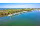 Aerial view of a charming boat dock and boats on a sunny day at 1375 Beach Rd # 109, Englewood, FL 34223