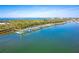 Scenic aerial shot capturing a tranquil boat dock and vessels embraced by sparkling waters on a sunny day at 1375 Beach Rd # 109, Englewood, FL 34223