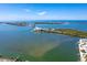 Breathtaking aerial view showcasing the coastal scenery with a bridge, clear turquoise water, and lush vegetation at 1375 Beach Rd # 109, Englewood, FL 34223