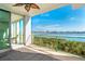 Balcony overlooking the bay with water views and green railings at 1375 Beach Rd # 109, Englewood, FL 34223