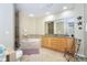 Spacious bathroom features a glass-enclosed shower and separate soaking tub at 1375 Beach Rd # 109, Englewood, FL 34223