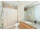 Clean bathroom with granite countertop, shower with curtain, and neutral tones at 1375 Beach Rd # 109, Englewood, FL 34223