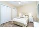 Comfortable bedroom with luxury vinyl flooring, ceiling fan and neutral wall paint at 1375 Beach Rd # 109, Englewood, FL 34223