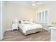 Bright bedroom with luxury vinyl flooring, plantation shutters and neutral wall paint at 1375 Beach Rd # 109, Englewood, FL 34223