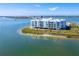 Contemporary waterfront condominium featuring Gulf views, a dock, and lush landscaping at 1375 Beach Rd # 109, Englewood, FL 34223