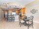 Modern kitchen with stainless steel appliances and a breakfast bar for casual dining at 1375 Beach Rd # 109, Englewood, FL 34223