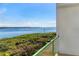 Relax on the balcony, overlooking lush greenery and tranquil waterfront views at 1375 Beach Rd # 109, Englewood, FL 34223