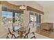 Bright dining area with a glass table and views of the screened-in lanai at 14405 Silver Lakes Cir, Port Charlotte, FL 33953