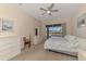 Bright main bedroom features an exit to the patio, neutral paint and carpet and and dressers at 14405 Silver Lakes Cir, Port Charlotte, FL 33953