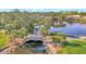 Aerial view of the lake with stone bridge and green landscape at 14429 Bridgeview Ln, Port Charlotte, FL 33953