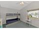 Bedroom featuring a bunk bed, neutral walls, and a small side table with a lamp at 14429 Bridgeview Ln, Port Charlotte, FL 33953