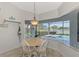 Breakfast nook boasts a view of the pool and lake at 14429 Bridgeview Ln, Port Charlotte, FL 33953