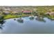 Aerial view of the house surrounded by the lake in gated community at 14429 Bridgeview Ln, Port Charlotte, FL 33953