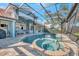 Beautiful pool and spa in screened in lanai with view of the home at 14429 Bridgeview Ln, Port Charlotte, FL 33953