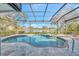 Beautiful pool and spa in screened in lanai with view of the water at 14429 Bridgeview Ln, Port Charlotte, FL 33953