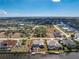 Aerial view of a neighborhood featuring waterfront homes along a canal, with private docks at 15524 Ruston Cir, Port Charlotte, FL 33981