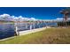 Waterfront home featuring a private dock and boat lift for easy access to the beautiful canal at 15524 Ruston Cir, Port Charlotte, FL 33981