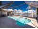 Screened pool featuring waterfront views, surrounded by palm trees, adjacent to the patio at 15524 Ruston Cir, Port Charlotte, FL 33981