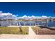 Waterfront backyard with a dock and canal views under a clear blue sky at 15524 Ruston Cir, Port Charlotte, FL 33981