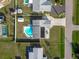 Aerial view of a home highlighting a backyard pool and landscaping at 1586 Overbrook Rd, Englewood, FL 34223