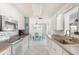 Bright kitchen featuring white cabinetry and appliances, with a dining area in the background at 1586 Overbrook Rd, Englewood, FL 34223