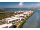 Stunning aerial view of waterfront condos with bay access and lush landscaping at 1591 Beach Rd # 403, Englewood, FL 34223