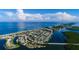 Expansive aerial view showcasing a coastal community nestled between the ocean and bay at 1591 Beach Rd # 403, Englewood, FL 34223