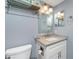 Neutral toned bathroom with white vanity and chrome faucet at 1591 Beach Rd # 403, Englewood, FL 34223