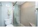 Bathroom featuring walk in shower with decor at 1591 Beach Rd # 403, Englewood, FL 34223